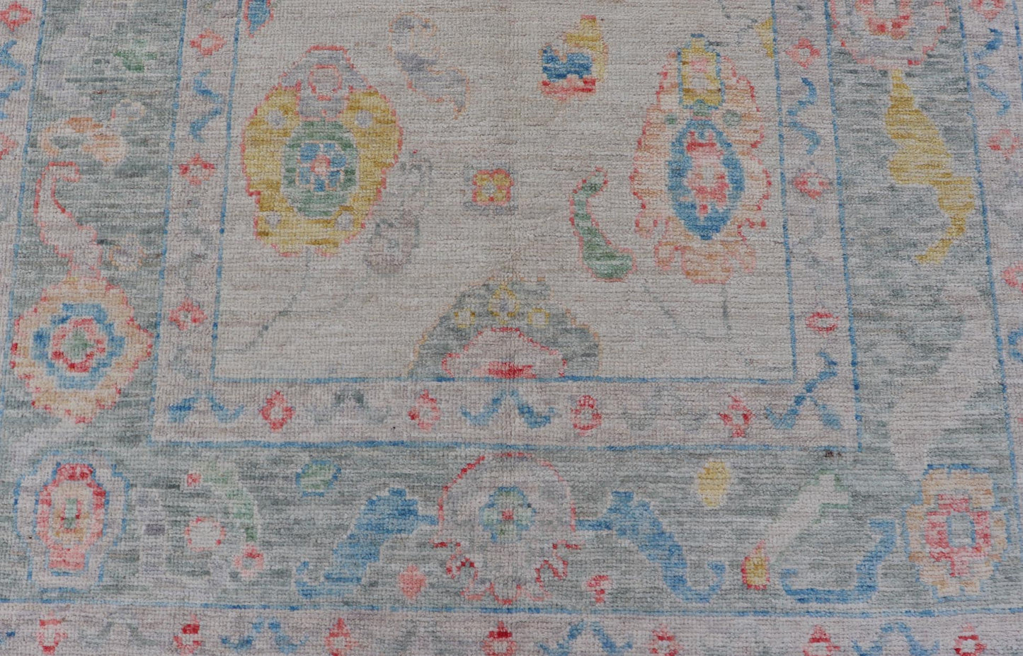 Modern All - Over Floral Oushak with Muted Background and Accent Colors Modern Oushak featuring an all - over, arabesque - like floral design, rendered in saturated oceanic blue, gold, green, red, and red - orange. The background is rendered in a co... - Keivan Woven ArtsAWR - 356 - 19959Rug