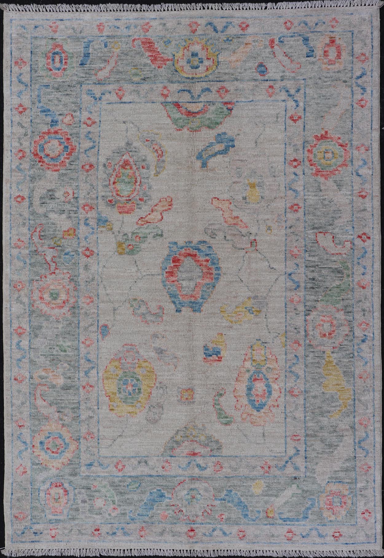 Modern All - Over Floral Oushak with Muted Background and Accent Colors Modern Oushak featuring an all - over, arabesque - like floral design, rendered in saturated oceanic blue, gold, green, red, and red - orange. The background is rendered in a co... - Keivan Woven ArtsAWR - 356 - 19959Rug