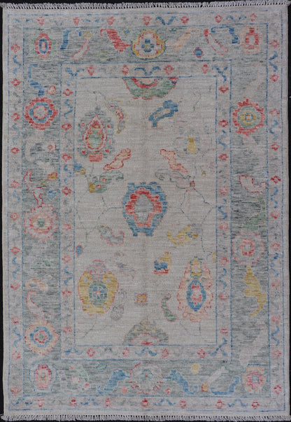 Modern All - Over Floral Oushak with Muted Background and Accent Colors Modern Oushak featuring an all - over, arabesque - like floral design, rendered in saturated oceanic blue, gold, green, red, and red - orange. The background is rendered in a co... - Keivan Woven ArtsAWR - 356 - 19959Rug