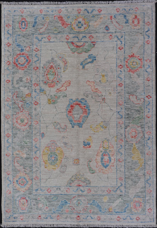 Modern All - Over Floral Oushak with Muted Background and Accent Colors Modern Oushak featuring an all - over, arabesque - like floral design, rendered in saturated oceanic blue, gold, green, red, and red - orange. The background is rendered in a co... - Keivan Woven ArtsAWR - 356 - 19959Rug