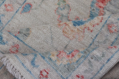 Modern All - Over Floral Oushak with Muted Background and Accent Colors Modern Oushak featuring an all - over, arabesque - like floral design, rendered in saturated oceanic blue, gold, green, red, and red - orange. The background is rendered in a co... - Keivan Woven ArtsAWR - 356 - 19959Rug