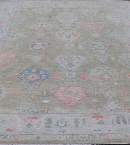 Measures: 9'1 x 12'0 Keivan Woven Arts Hand - Knotted Transitional Neutral Oushak Rug. Keivan Woven Arts; rug AWR - 378 / Country of Origin: Afghanistan Type: Oushak Design: All - Over, Floral. Above lays a modest Oushak - styled floral design reaching... - Keivan Woven ArtsAWR - 378 - 27448Rug