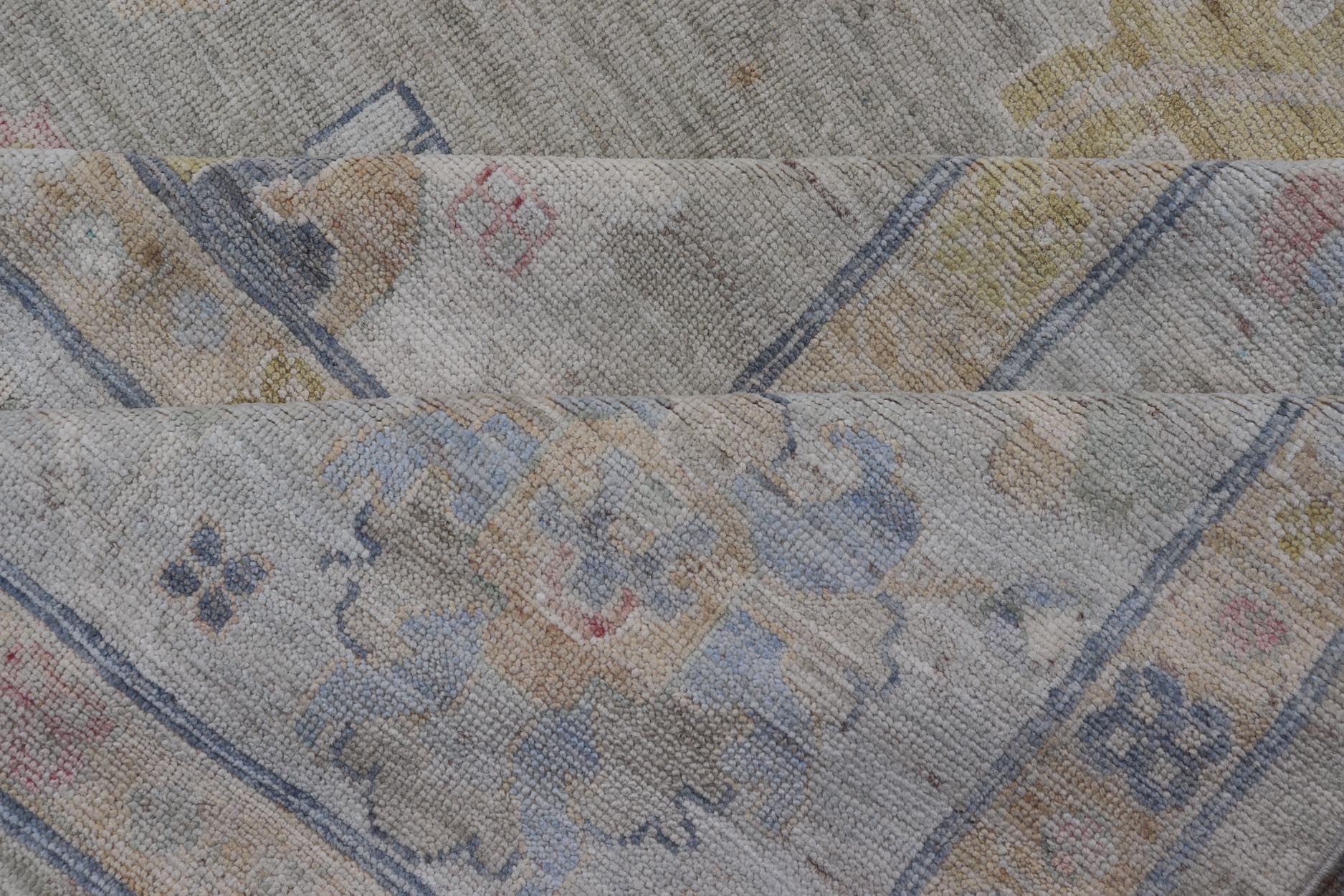 Measures: 12'1 x 17'10 Modern Large Oushak by Keivan Woven Arts with Floral Motifs. Keivan Woven Arts; rug AWR - 405 Country of Origin: Afghanistan Type: Oushak Design. This large Oushak has a border and background that are covered in floral - l... - Keivan Woven ArtsAWR - 405 - 27454Rug