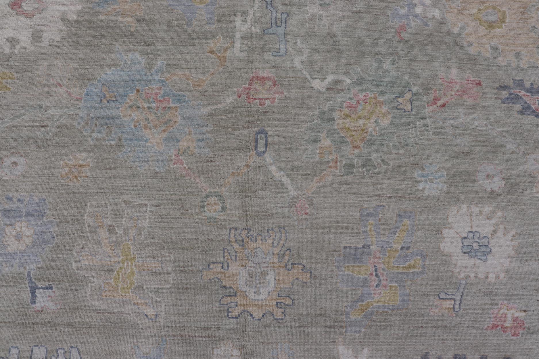 Measures: 12'1 x 17'10 Modern Large Oushak by Keivan Woven Arts with Floral Motifs. Keivan Woven Arts; rug AWR - 405 Country of Origin: Afghanistan Type: Oushak Design. This large Oushak has a border and background that are covered in floral - l... - Keivan Woven ArtsAWR - 405 - 27454Rug