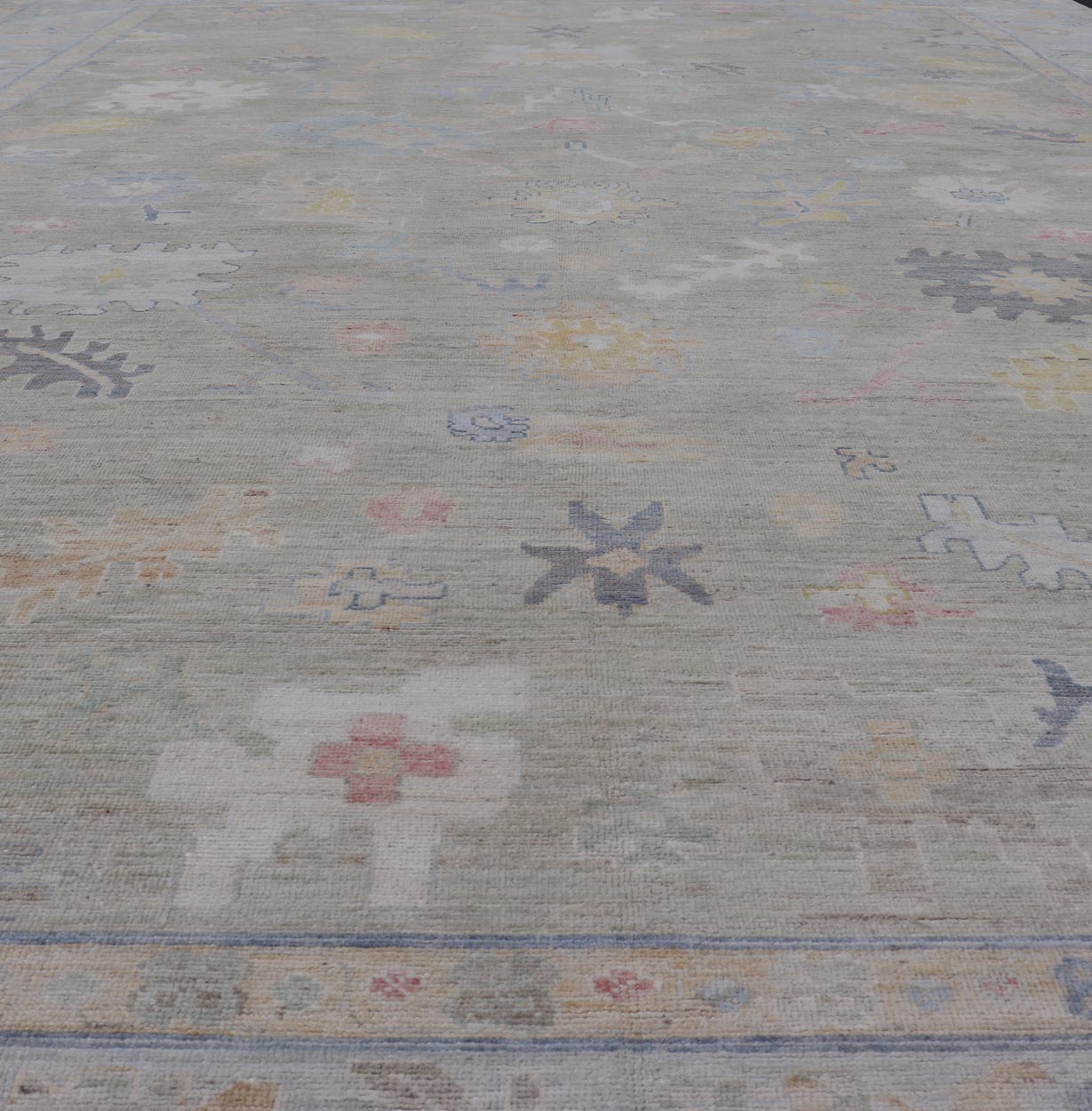 Measures: 12'1 x 17'10 Modern Large Oushak by Keivan Woven Arts with Floral Motifs. Keivan Woven Arts; rug AWR - 405 Country of Origin: Afghanistan Type: Oushak Design. This large Oushak has a border and background that are covered in floral - l... - Keivan Woven ArtsAWR - 405 - 27454Rug