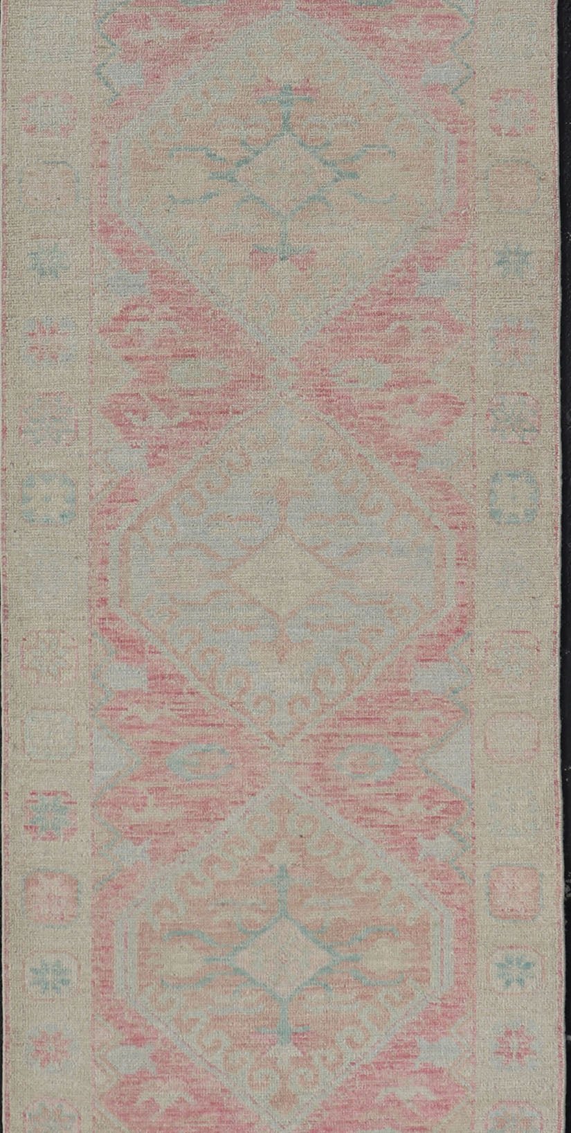 Modern Hand Knotted Oushak Runner With Medallions in Pink's and Creams. Keivan Woven Arts; AWR - 4982 Country of Origin: Afghanistan Type: Oushak Design: Tribal, Measures: 3'0 x 12'9 This long Oushak runner has a light pink background with ... - Keivan Woven ArtsAWR - 4982 - 17136Rug