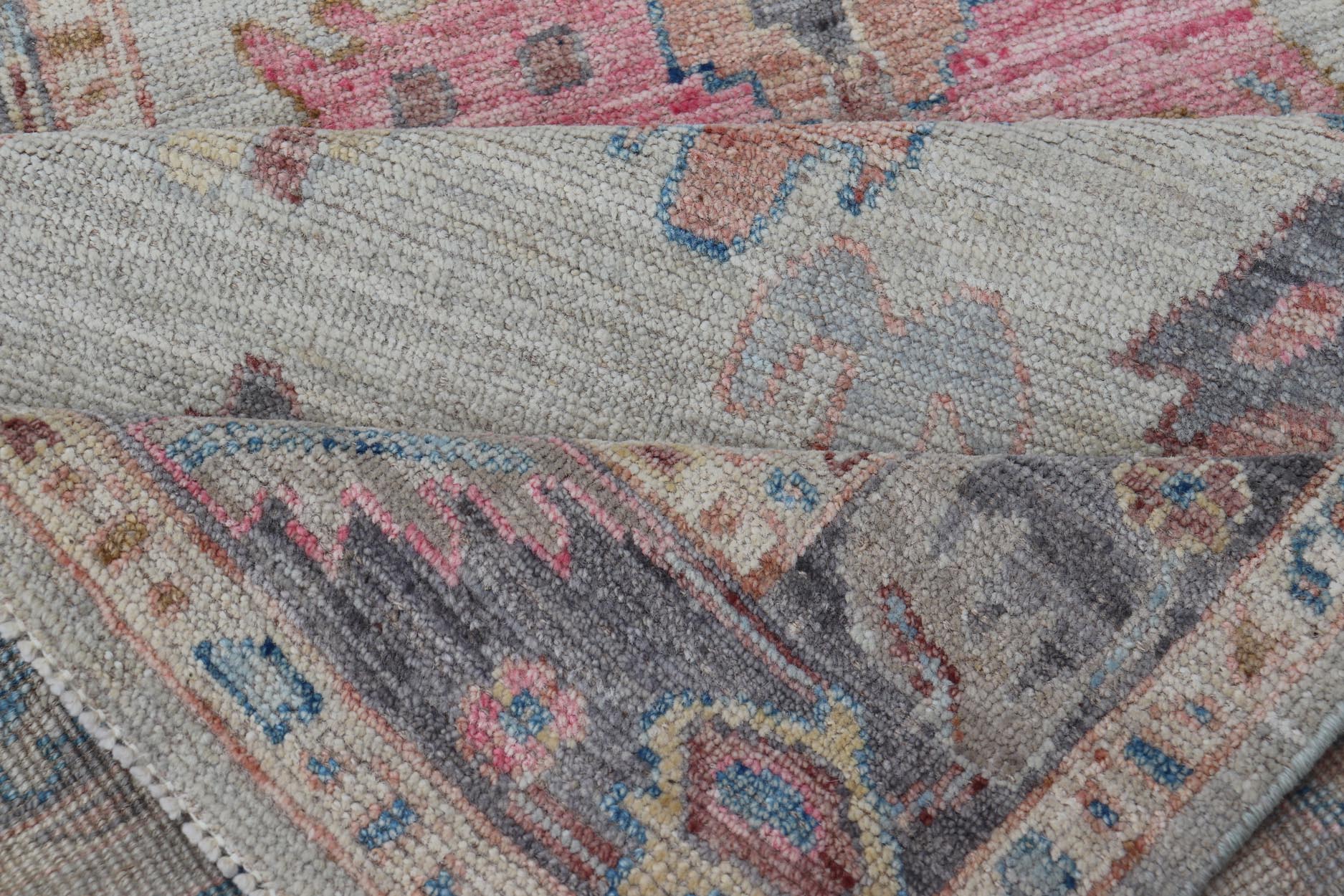 Hand - Knotted Modern Tribal Oushak Long Runner in Wool with Colorful Motifs This long Oushak runner has a cream background with a light gray border. The border has a leaflet - like design is rendered in green, coral, and blue with a hint of ye... - Keivan Woven ArtsAWR - 6026 - 19965Rug
