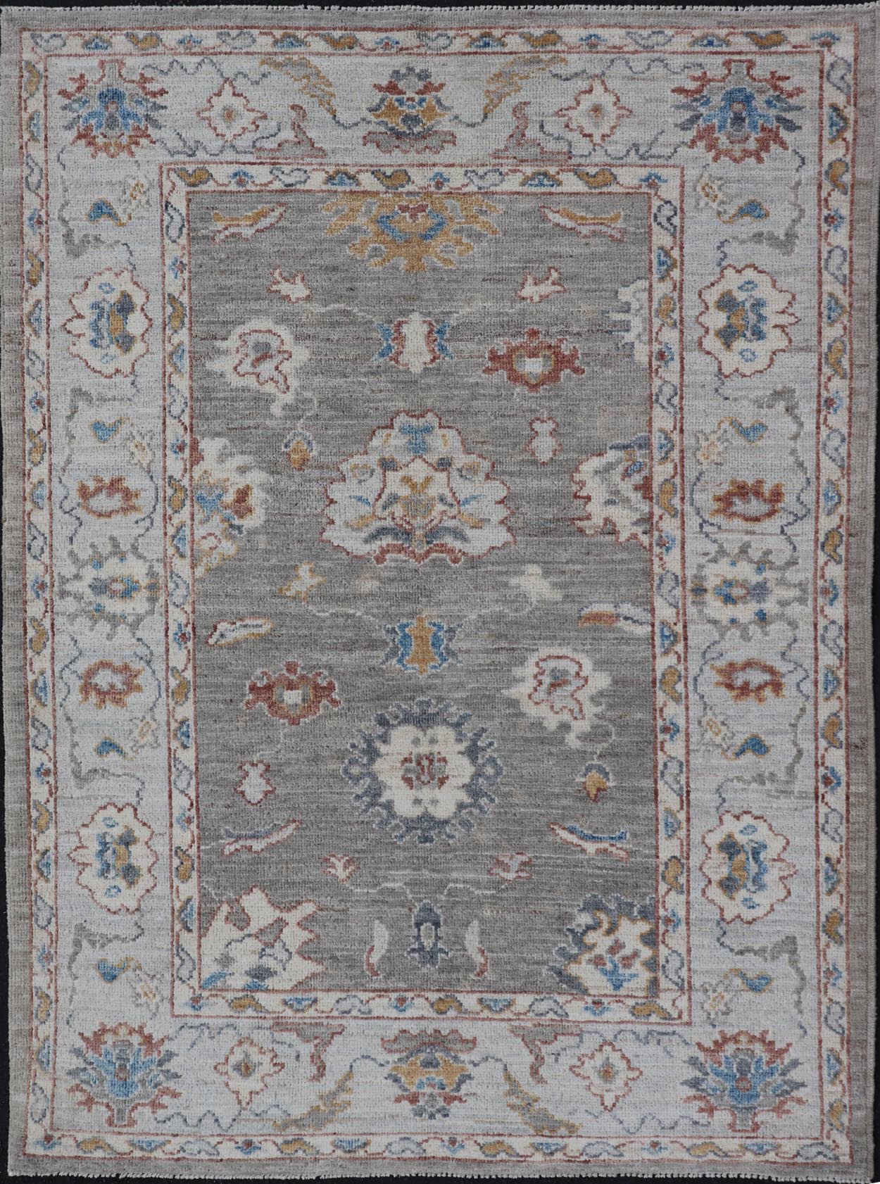 Floral Designed Oushak with Muted Background With Earthy Tones and Soft Blue Modern Oushak featuring an all - over, arabesque - like floral design. The background is rendered in a light gray, while the border is s light pewter blue. The design d... - Keivan Woven ArtsAWR - 6028 - 19971Rug