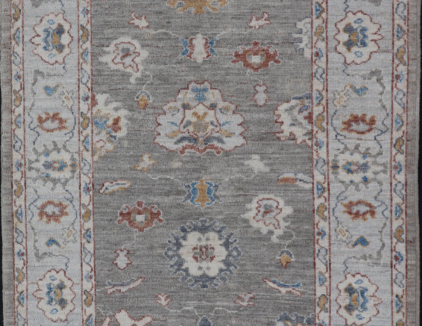 Floral Designed Oushak with Muted Background With Earthy Tones and Soft Blue Modern Oushak featuring an all - over, arabesque - like floral design. The background is rendered in a light gray, while the border is s light pewter blue. The design d... - Keivan Woven ArtsAWR - 6028 - 19971Rug