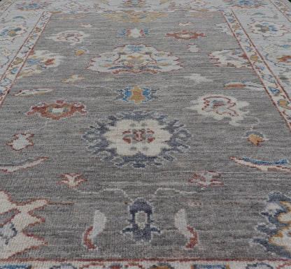 Floral Designed Oushak with Muted Background With Earthy Tones and Soft Blue Modern Oushak featuring an all - over, arabesque - like floral design. The background is rendered in a light gray, while the border is s light pewter blue. The design d... - Keivan Woven ArtsAWR - 6028 - 19971Rug