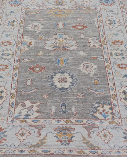 Floral Designed Oushak with Muted Background With Earthy Tones and Soft Blue Modern Oushak featuring an all - over, arabesque - like floral design. The background is rendered in a light gray, while the border is s light pewter blue. The design d... - Keivan Woven ArtsAWR - 6028 - 19971Rug