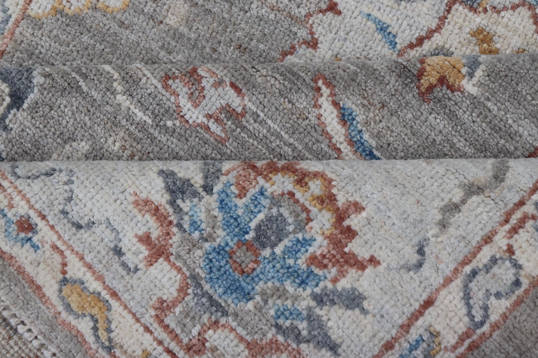 Floral Designed Oushak with Muted Background With Earthy Tones and Soft Blue Modern Oushak featuring an all - over, arabesque - like floral design. The background is rendered in a light gray, while the border is s light pewter blue. The design d... - Keivan Woven ArtsAWR - 6028 - 19971Rug