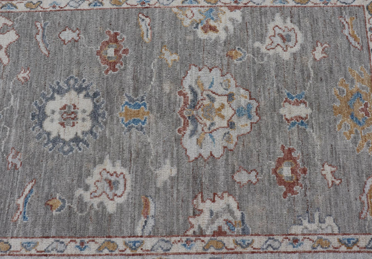Floral Designed Oushak with Muted Background With Earthy Tones and Soft Blue Modern Oushak featuring an all - over, arabesque - like floral design. The background is rendered in a light gray, while the border is s light pewter blue. The design d... - Keivan Woven ArtsAWR - 6028 - 19971Rug