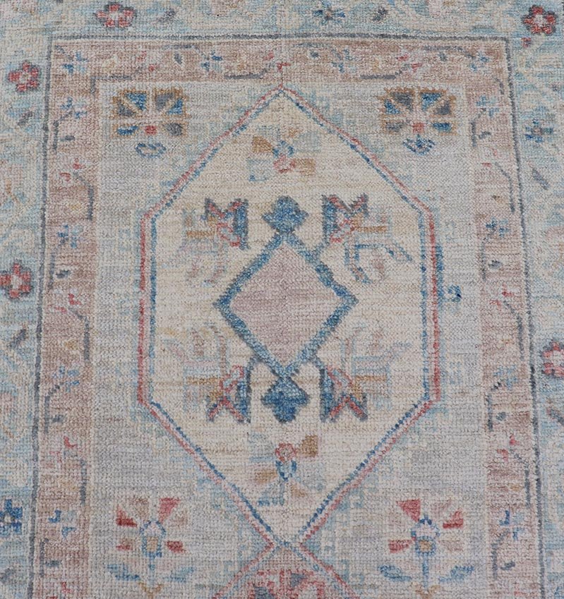 Hand - Knotted Oushak Runner with Medallion Design On A Cream Field With Blues This modern piece holds large medallions in the field, each of which are encasing floral - like motifs. The border is rendered in light blue and coral both embroidere... - Keivan Woven ArtsAWR - 6036 - 19977Rug