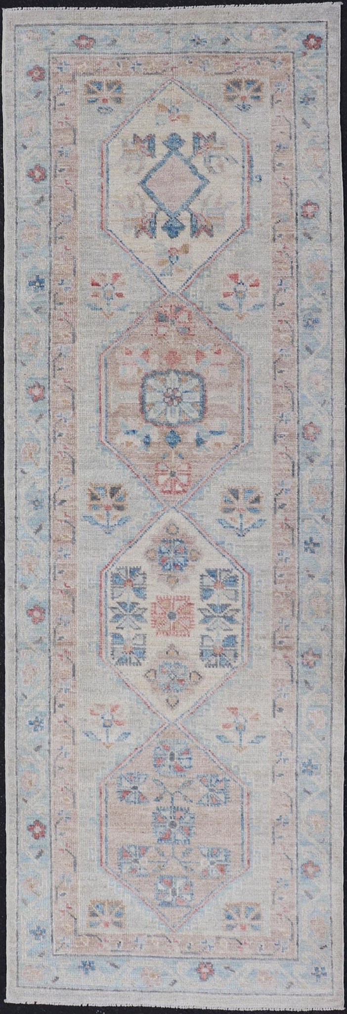 Hand - Knotted Oushak Runner with Medallion Design On A Cream Field With Blues This modern piece holds large medallions in the field, each of which are encasing floral - like motifs. The border is rendered in light blue and coral both embroidere... - Keivan Woven ArtsAWR - 6036 - 19977Rug