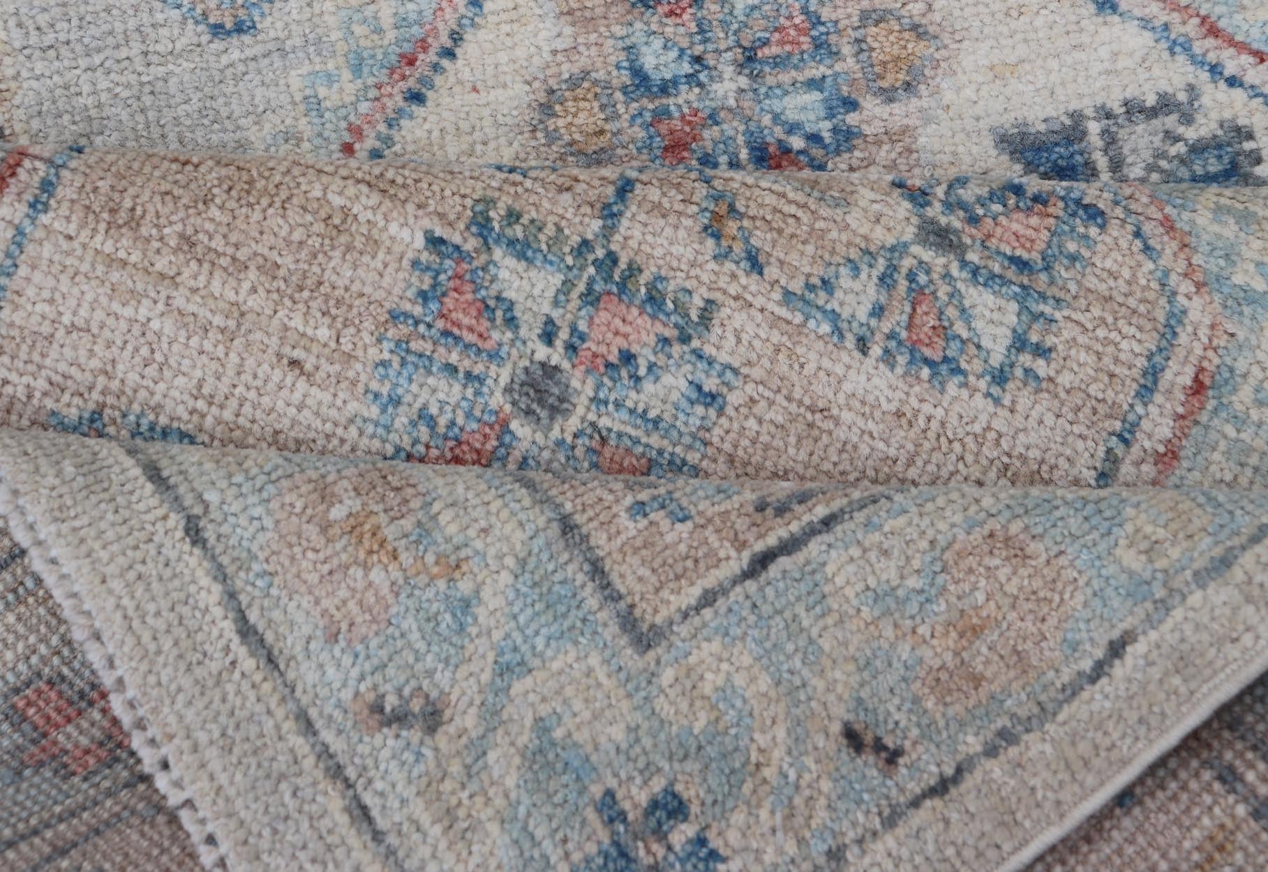 Hand - Knotted Oushak Runner with Medallion Design On A Cream Field With Blues This modern piece holds large medallions in the field, each of which are encasing floral - like motifs. The border is rendered in light blue and coral both embroidere... - Keivan Woven ArtsAWR - 6036 - 19977Rug