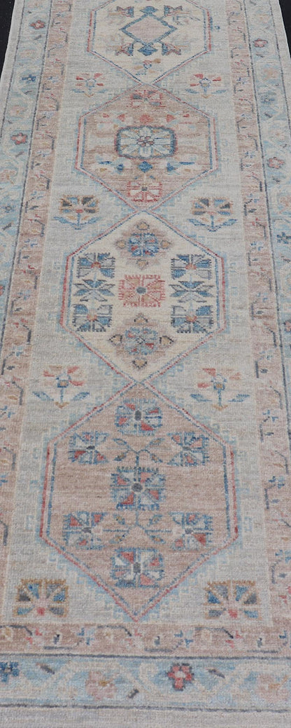 Hand - Knotted Oushak Runner with Medallion Design On A Cream Field With Blues This modern piece holds large medallions in the field, each of which are encasing floral - like motifs. The border is rendered in light blue and coral both embroidere... - Keivan Woven ArtsAWR - 6036 - 19977Rug