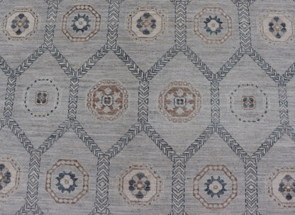 Sub - Geometric Mosaic Khotan Rug With Muted Tones of Blue and Brown This hand - knotted Khotan features geometric medallions, each of which hold a small geometric motif. The border hosts different geometric designs on each tier, alternating between... - Keivan Woven ArtsAWR - 6044 - 19989Rug