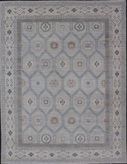 Sub - Geometric Mosaic Khotan Rug With Muted Tones of Blue and Brown This hand - knotted Khotan features geometric medallions, each of which hold a small geometric motif. The border hosts different geometric designs on each tier, alternating between... - Keivan Woven ArtsAWR - 6044 - 19989Rug