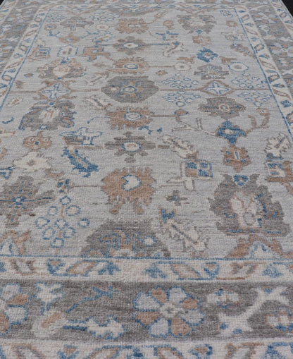 Hand - Knotted All - Over Floral Modern Oushak With Light Brown Border This beautiful contemporary piece starts with a floral border. The field has a modest silvery background with an all - over design rendered with earthy tones, such as wood brown, t... - Keivan Woven ArtsAWR - 6060 - 20001Rug