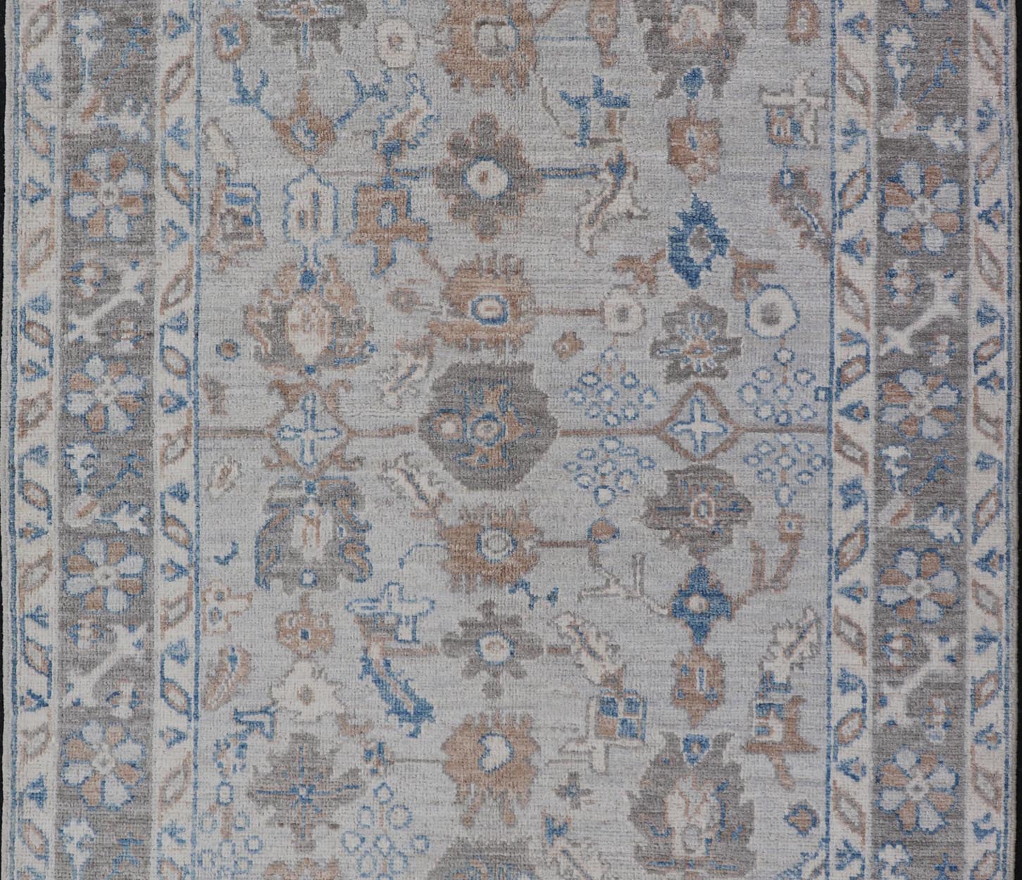 Hand - Knotted All - Over Floral Modern Oushak With Light Brown Border This beautiful contemporary piece starts with a floral border. The field has a modest silvery background with an all - over design rendered with earthy tones, such as wood brown, t... - Keivan Woven ArtsAWR - 6060 - 20001Rug