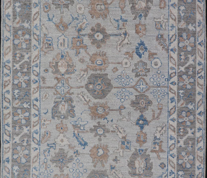 Hand - Knotted All - Over Floral Modern Oushak With Light Brown Border This beautiful contemporary piece starts with a floral border. The field has a modest silvery background with an all - over design rendered with earthy tones, such as wood brown, t... - Keivan Woven ArtsAWR - 6060 - 20001Rug