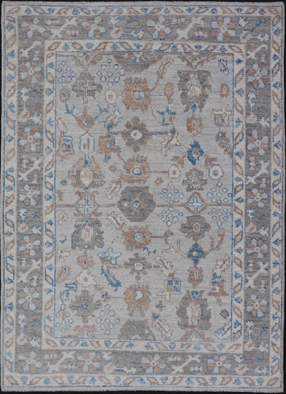 Hand - Knotted All - Over Floral Modern Oushak With Light Brown Border This beautiful contemporary piece starts with a floral border. The field has a modest silvery background with an all - over design rendered with earthy tones, such as wood brown, t... - Keivan Woven ArtsAWR - 6060 - 20001Rug