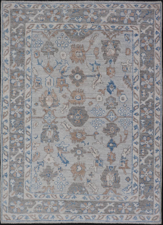 Hand - Knotted All - Over Floral Modern Oushak With Light Brown Border This beautiful contemporary piece starts with a floral border. The field has a modest silvery background with an all - over design rendered with earthy tones, such as wood brown, t... - Keivan Woven ArtsAWR - 6060 - 20001