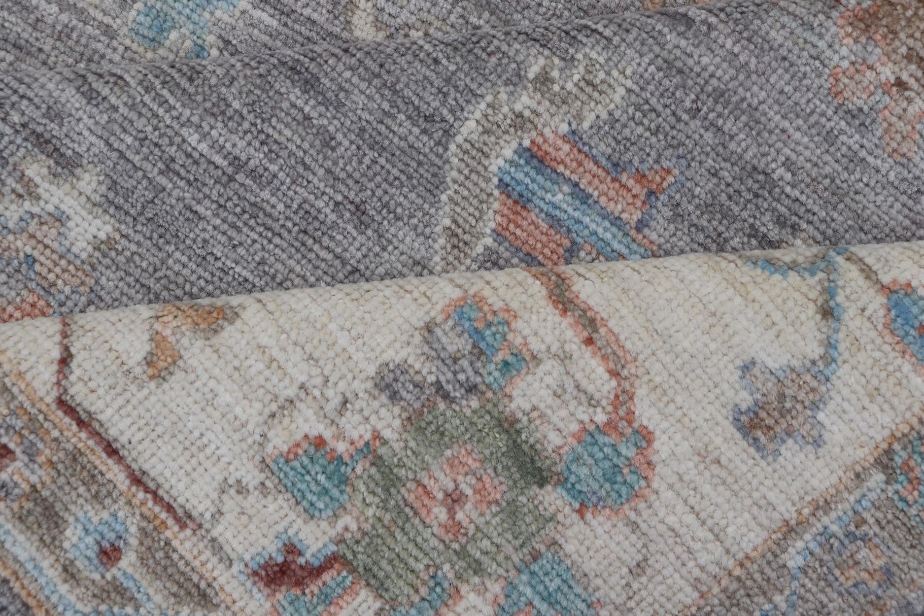 Hand Knotted Floral Oushak With a Gray Background and Multi - Colors This modern casual floral Oushak designed rug has been hand - knotted in wool. The rug features a modern sub - geometric floral design which is enclosed within a complementary, doubl... - Keivan Woven ArtsAWR - 6107 - 20007Rug