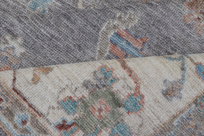 Hand Knotted Floral Oushak With a Gray Background and Multi - Colors This modern casual floral Oushak designed rug has been hand - knotted in wool. The rug features a modern sub - geometric floral design which is enclosed within a complementary, doubl... - Keivan Woven ArtsAWR - 6107 - 20007Rug