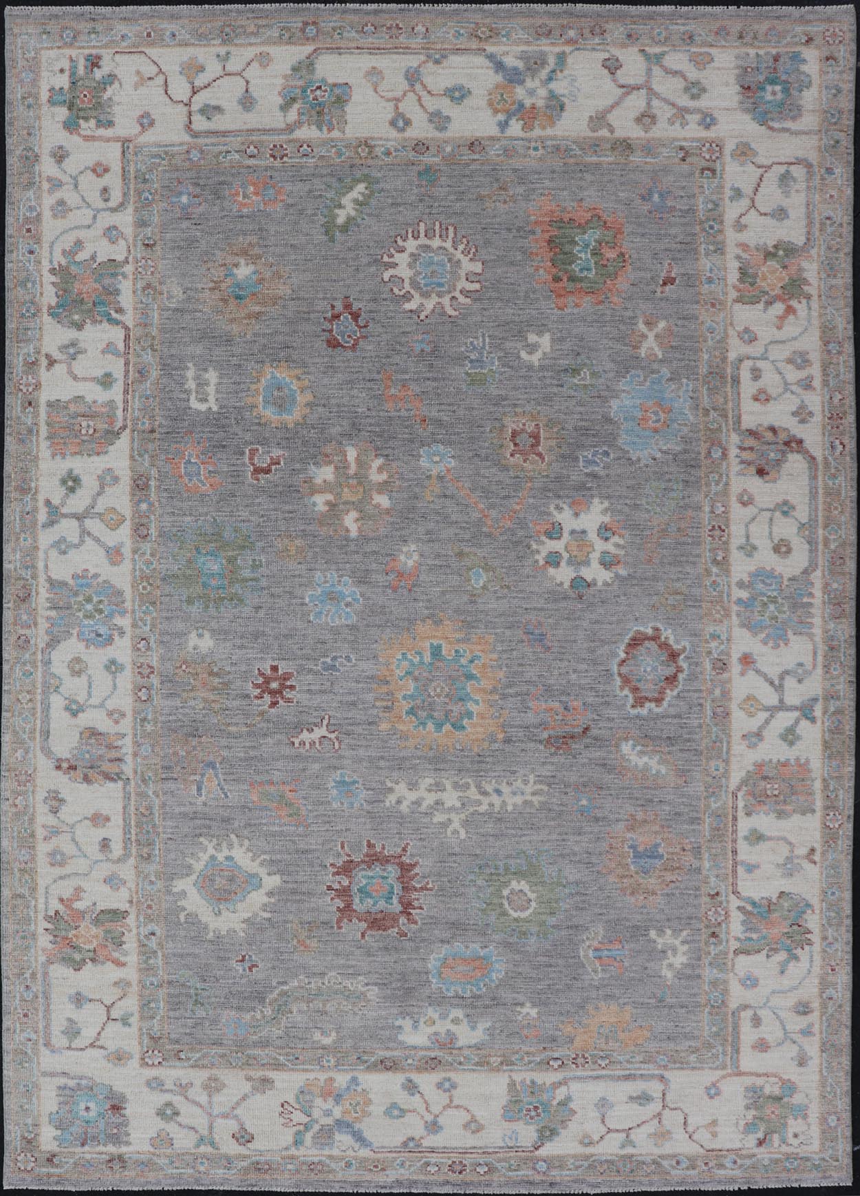 Hand Knotted Floral Oushak With a Gray Background and Multi - Colors This modern casual floral Oushak designed rug has been hand - knotted in wool. The rug features a modern sub - geometric floral design which is enclosed within a complementary, doubl... - Keivan Woven ArtsAWR - 6107 - 20007Rug