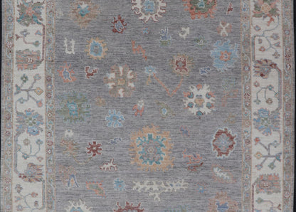 Hand Knotted Floral Oushak With a Gray Background and Multi - Colors This modern casual floral Oushak designed rug has been hand - knotted in wool. The rug features a modern sub - geometric floral design which is enclosed within a complementary, doubl... - Keivan Woven ArtsAWR - 6107 - 20007Rug