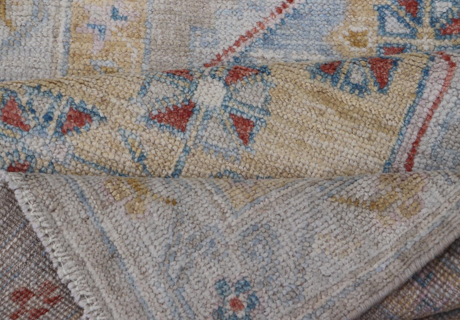 Hand - Knotted Floral Medallion Oushak Runner in Blue and Yellow This piece showcases brilliant medallions encasing star - like motifs in yellow, coral, orange, light blue, and cream. The border displays a yellow band between a cream background.... - Keivan Woven ArtsAWR - 6116 - 20013Rug