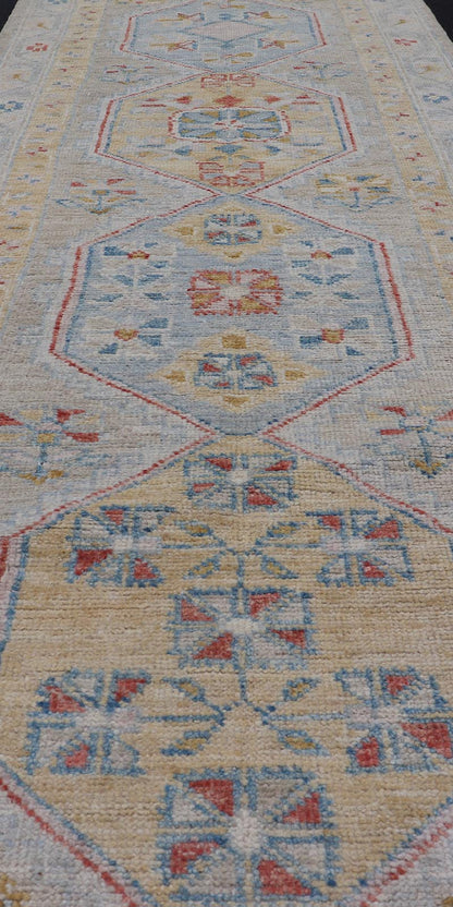 Hand - Knotted Medallion Oushak Design Runner featuring Faded Yellow and Blue's This piece showcases brilliant medallions encasing motifs in buttery yellow, light blue, cream, and shades of blue. The border displays a yellow guard border with a cr... - Keivan Woven ArtsAWR - 6117 - 20019Rug