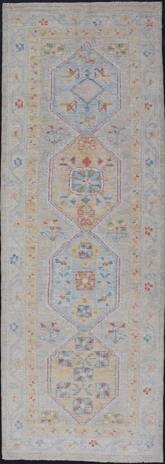 Hand - Knotted Medallion Oushak Design Runner featuring Faded Yellow and Blue's This piece showcases brilliant medallions encasing motifs in buttery yellow, light blue, cream, and shades of blue. The border displays a yellow guard border with a cr... - Keivan Woven ArtsAWR - 6117 - 20019Rug