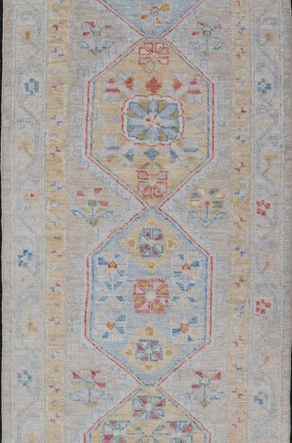 Hand - Knotted Medallion Oushak Design Runner featuring Faded Yellow and Blue's This piece showcases brilliant medallions encasing motifs in buttery yellow, light blue, cream, and shades of blue. The border displays a yellow guard border with a cr... - Keivan Woven ArtsAWR - 6117 - 20019Rug