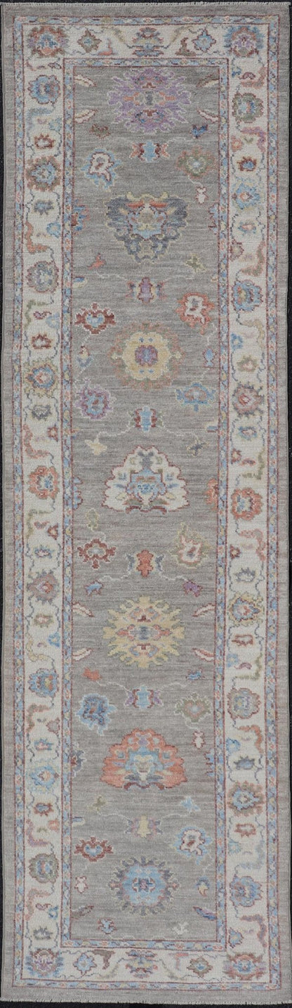 Hand - Knotted Modern Oushak Runner on Light Gray Field and Colorful Motifs This Oushak runner has been hand - knotted. The arabesque motifs scatter atop a light gray background. Within the field, bright displays of gold, teal, blue, pink, maroon, ... - Keivan Woven ArtsAWR - 6196 - 19899Rug