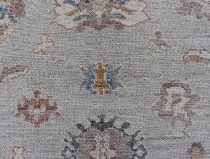 Floral Modern Oushak With Muted Gray Background and Cream Border This piece gives a modern vibrancy to the classic floral Oushak design. With a louder light gray background, the field showcases bold accents of cream and taupe in a half - floral, ... - Keivan Woven ArtsAWR - 6287 - 20031Rug