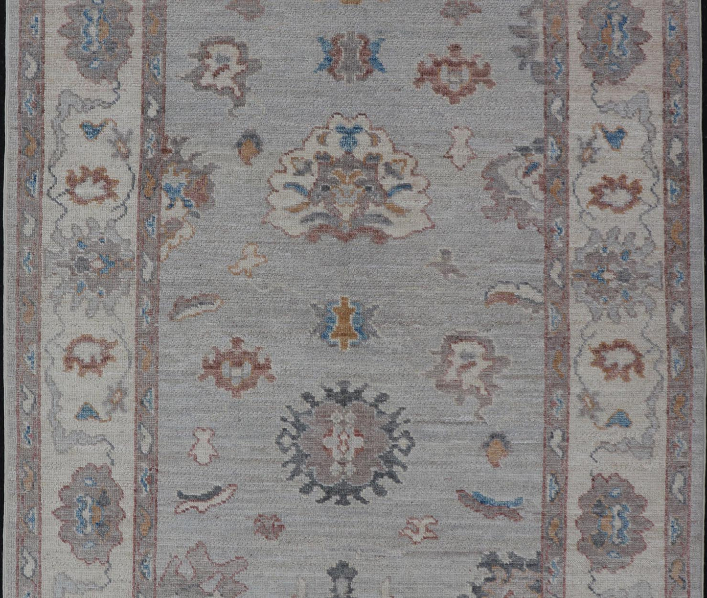 Floral Modern Oushak With Muted Gray Background and Cream Border This piece gives a modern vibrancy to the classic floral Oushak design. With a louder light gray background, the field showcases bold accents of cream and taupe in a half - floral, ... - Keivan Woven ArtsAWR - 6287 - 20031Rug