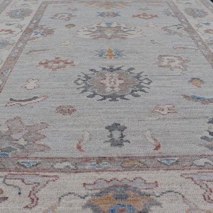 Floral Modern Oushak With Muted Gray Background and Cream Border This piece gives a modern vibrancy to the classic floral Oushak design. With a louder light gray background, the field showcases bold accents of cream and taupe in a half - floral, ... - Keivan Woven ArtsAWR - 6287 - 20031Rug