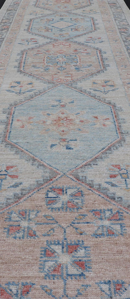 Modern Oushak Medallion Runner in Pastel Color Tones This Afghan Oushak presents a double - lined floral border on top of a light gray background, accenting colors such as blue, red, and salmon. These mix of tones gives a great contrast to many in... - Keivan Woven ArtsAWR - 6290 - 20037Rug