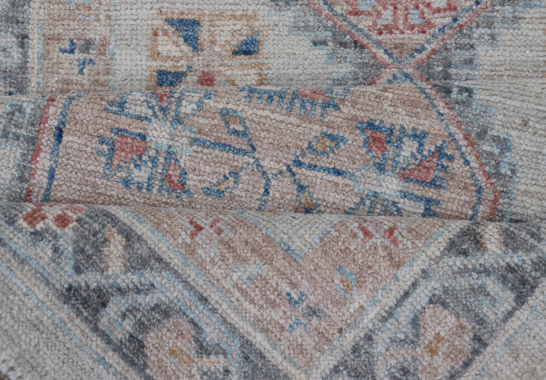 Modern Oushak Medallion Runner in Pastel Color Tones This Afghan Oushak presents a double - lined floral border on top of a light gray background, accenting colors such as blue, red, and salmon. These mix of tones gives a great contrast to many in... - Keivan Woven ArtsAWR - 6290 - 20037Rug
