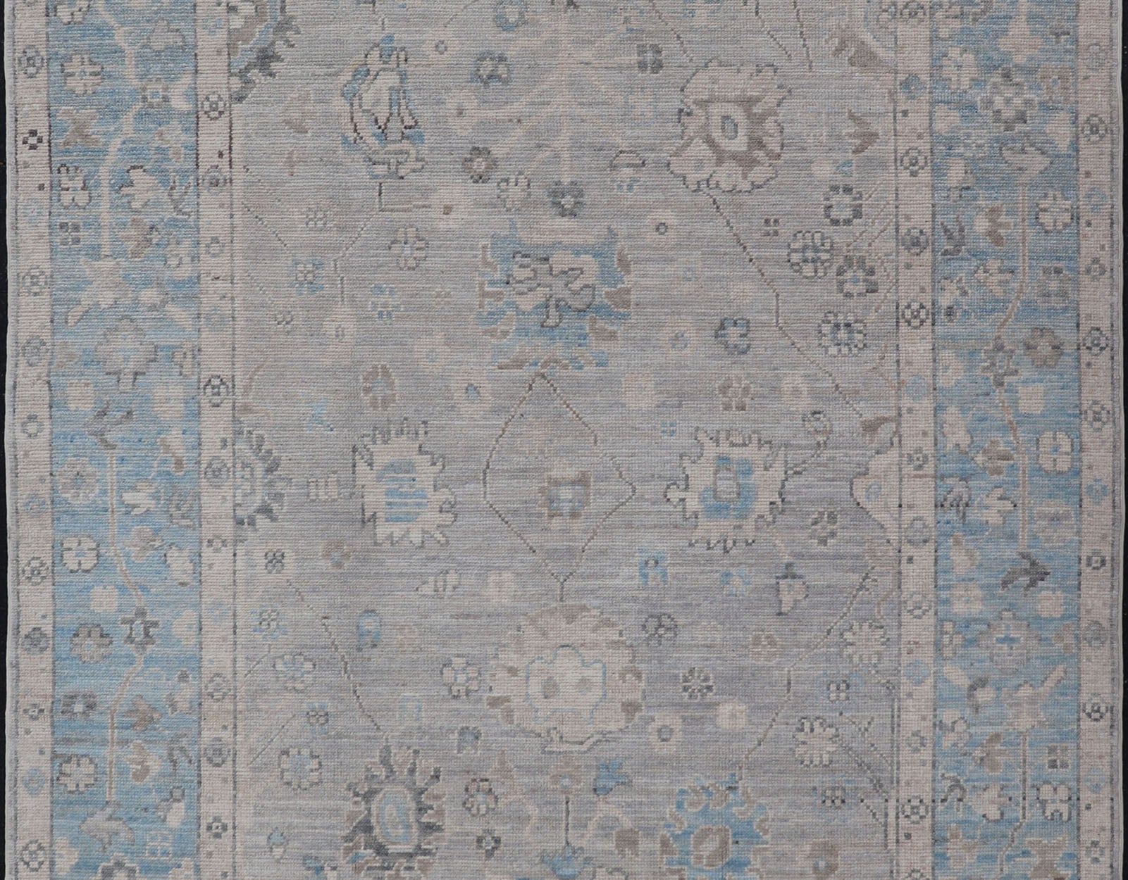 Hand - Knotted Light Blue Oushak with Light Gray Background Hand - Knotted in Afghanistan, this rustic piece holds charm within a powder blue border and a light gray field background. Above lays a modest Oushak - styled floral design reaching all ... - Keivan Woven ArtsAWR - 6309 - 20049Rug