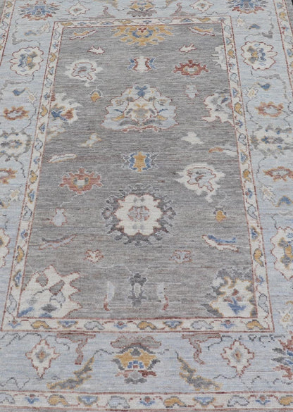 Modern Hand Knotted Oushak with Muted Background and Earthy Accents This beautiful rug starts in a light gray background, paired with a steel blue in the border. The design is an all - over Oushak floral design, highlighting unique colors, su... - Keivan Woven ArtsAWR - 6320 - 20055Rug