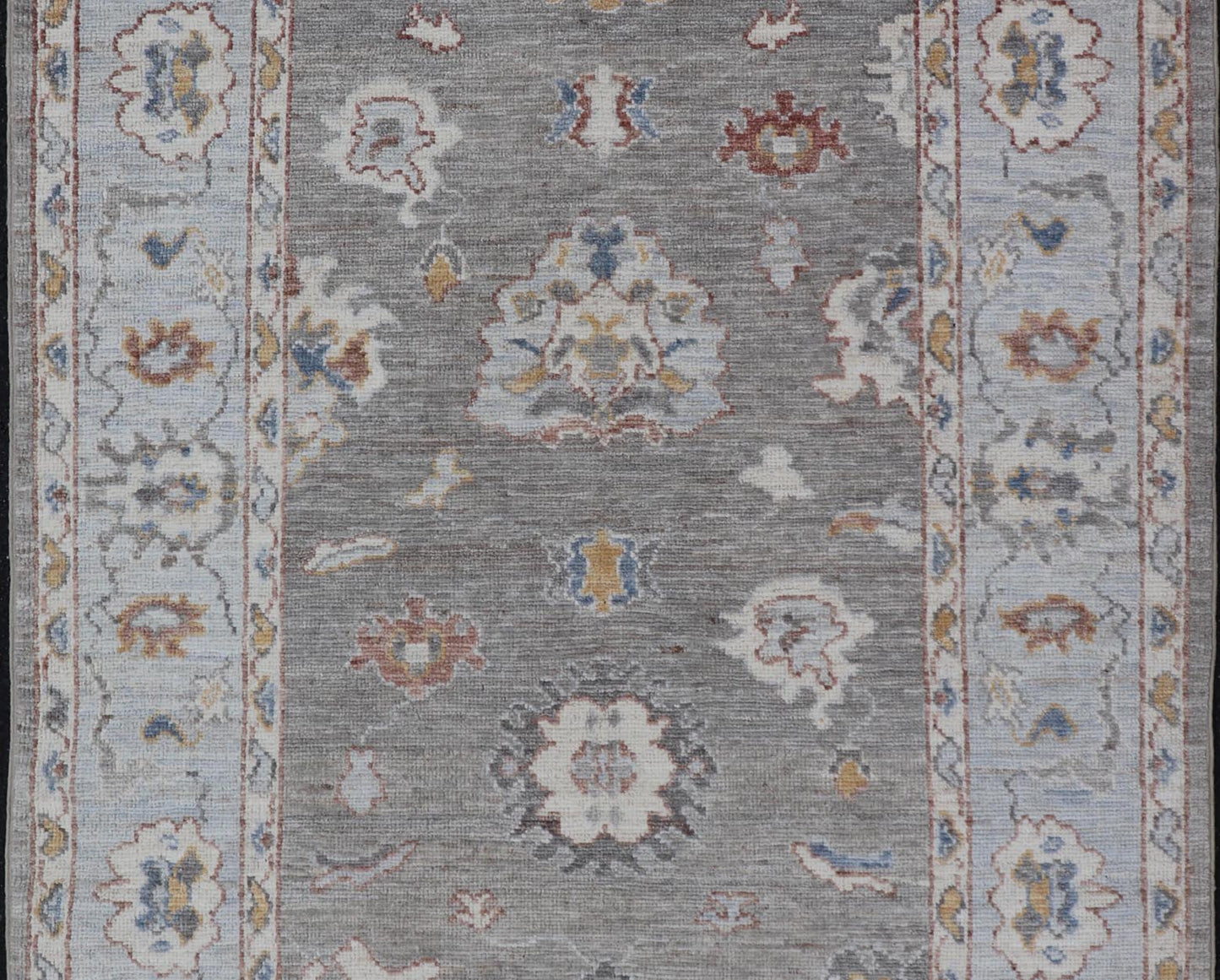 Modern Hand Knotted Oushak with Muted Background and Earthy Accents This beautiful rug starts in a light gray background, paired with a steel blue in the border. The design is an all - over Oushak floral design, highlighting unique colors, su... - Keivan Woven ArtsAWR - 6320 - 20055Rug
