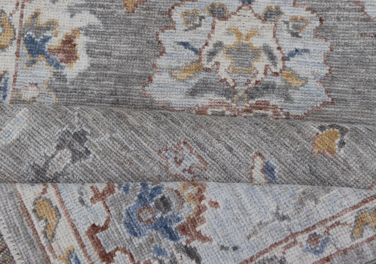 Modern Hand Knotted Oushak with Muted Background and Earthy Accents This beautiful rug starts in a light gray background, paired with a steel blue in the border. The design is an all - over Oushak floral design, highlighting unique colors, su... - Keivan Woven ArtsAWR - 6320 - 20055Rug