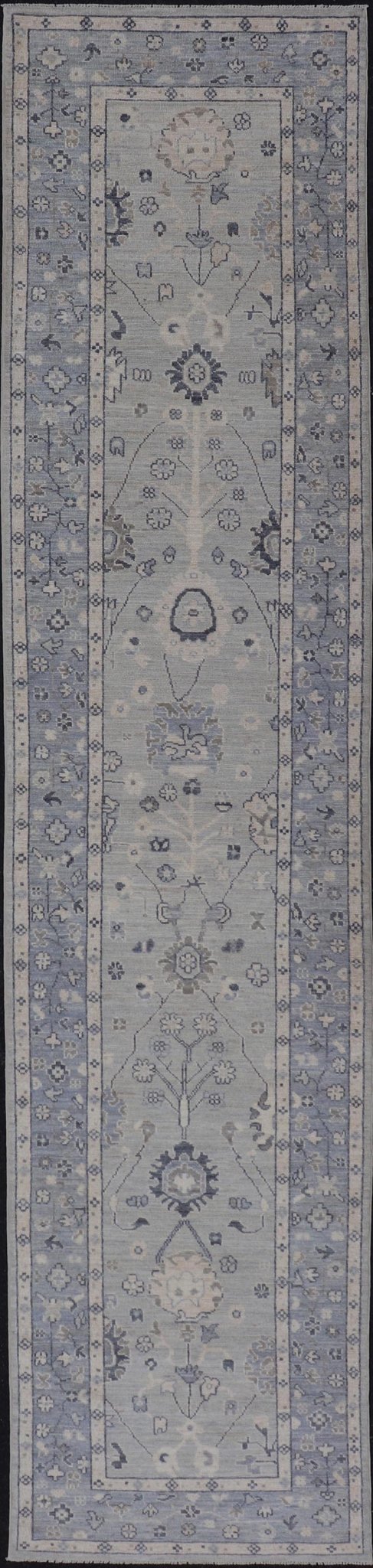 Modern Oushak Design With Light Blue Background and All - Over Design This Afghan runner features a classic Oushak look, showing off brilliant floral motifs and vines reaching all over the field against a cool gray and pewter background. Central ... - Keivan Woven ArtsAWR - 6325 - 20061Rug