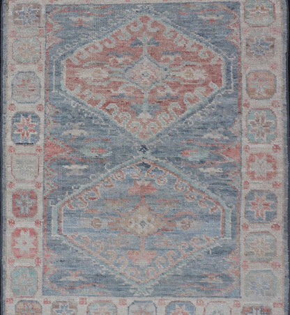 Medallion Designed Modern Oushak with Light Blue Background and Cream Border This modern Oushak features large medallions in the center of a light blue background, centering around shades of blue, coral, and light green. The border features seve... - Keivan Woven ArtsAWR - 6363 - 20073Rug