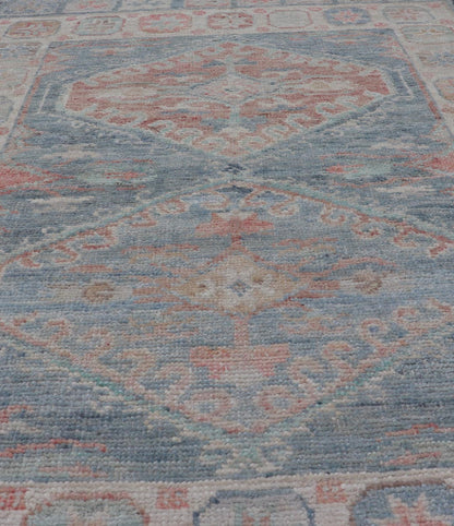 Medallion Designed Modern Oushak with Light Blue Background and Cream Border This modern Oushak features large medallions in the center of a light blue background, centering around shades of blue, coral, and light green. The border features seve... - Keivan Woven ArtsAWR - 6363 - 20073Rug
