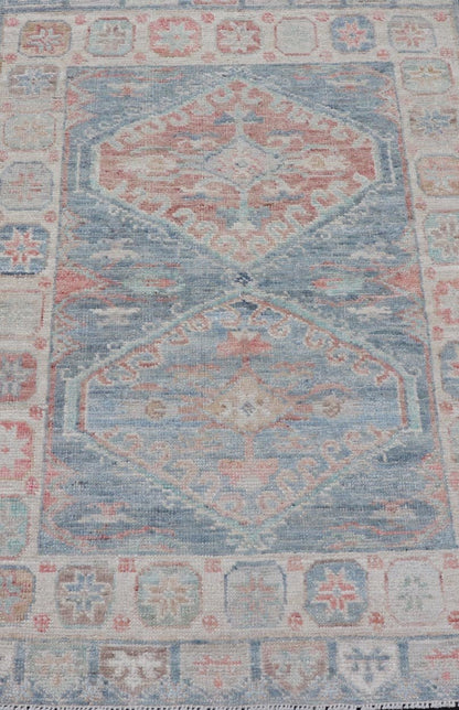 Medallion Designed Modern Oushak with Light Blue Background and Cream Border This modern Oushak features large medallions in the center of a light blue background, centering around shades of blue, coral, and light green. The border features seve... - Keivan Woven ArtsAWR - 6363 - 20073Rug